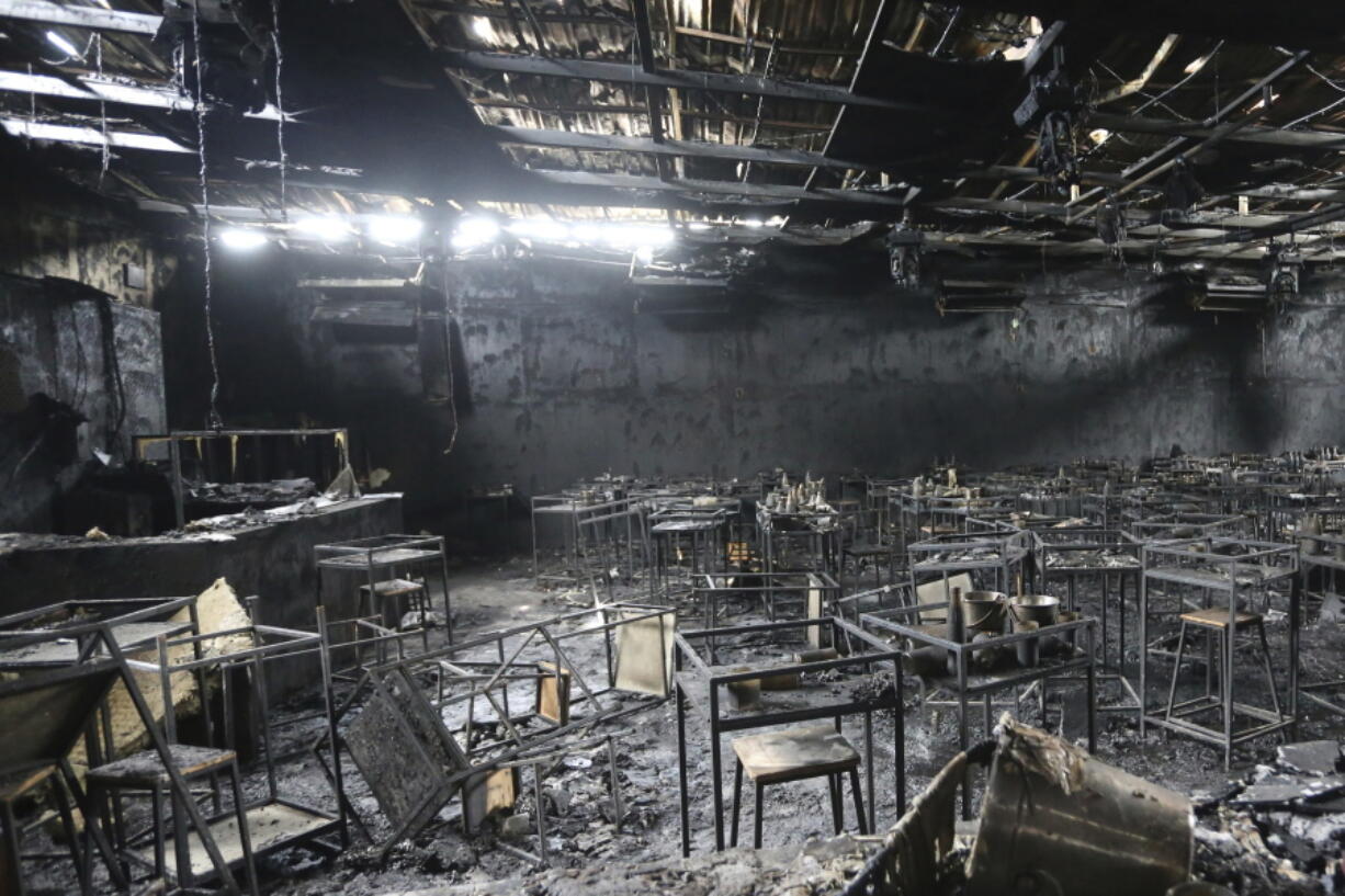 Major fire damage fills the interior at the Mountain B pub in the Sattahip district of Chonburi province, about 160 kilometers (100 miles) southeast of Bangkok, Thailand. Over a dozen people were killed and dozens injured when a fire broke out early Friday morning at the crowded music pub, police and rescue workers said.