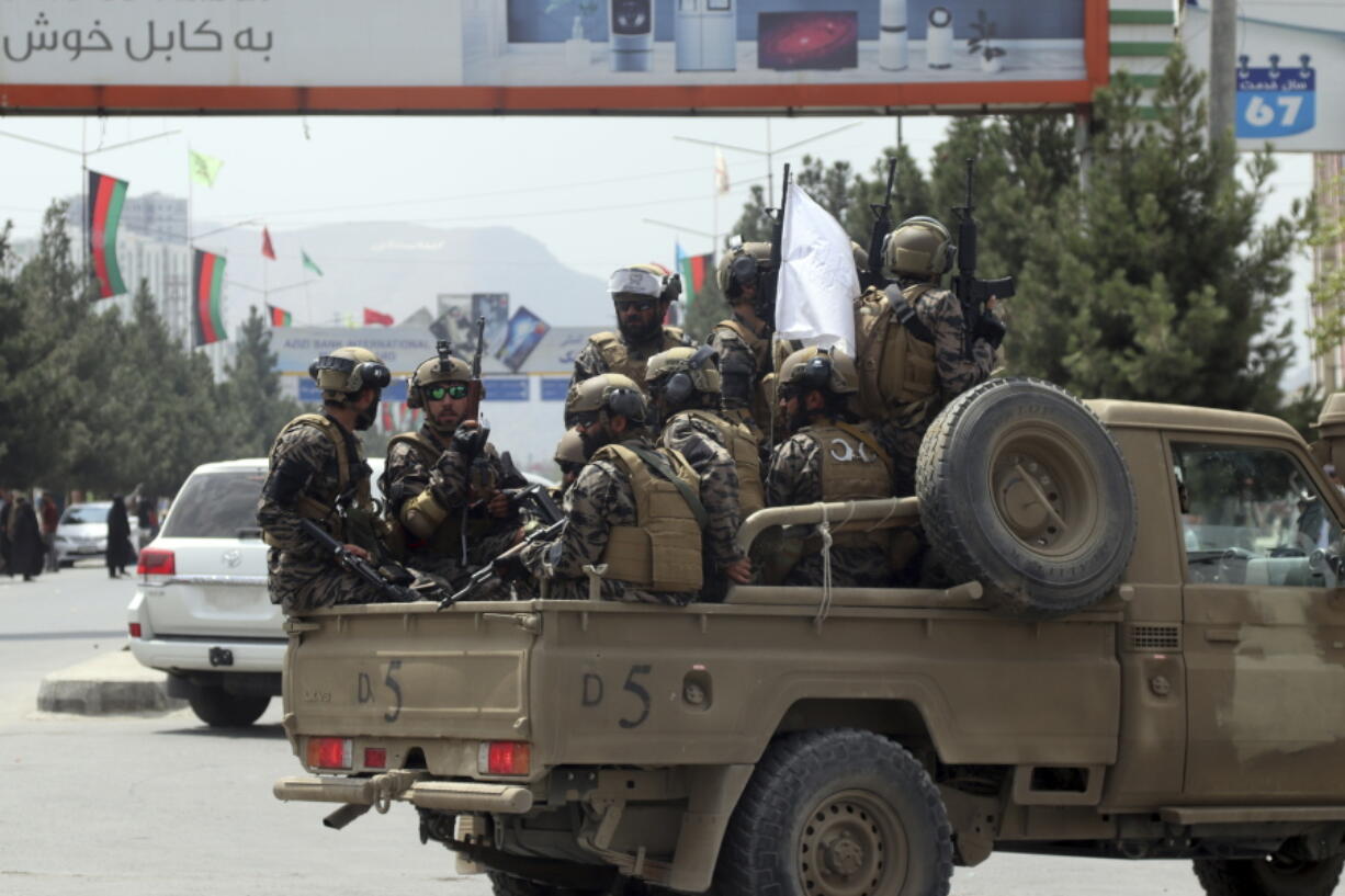FILE - Taliban special force fighters arrive inside the Hamid Karzai International Airport after the U.S. military's withdrawal, in Kabul, Afghanistan, Aug. 31, 2021. A year after America's tumultuous and deadly withdrawal from Afghanistan, assessments of its impact are divided -- and largely along partisan lines.