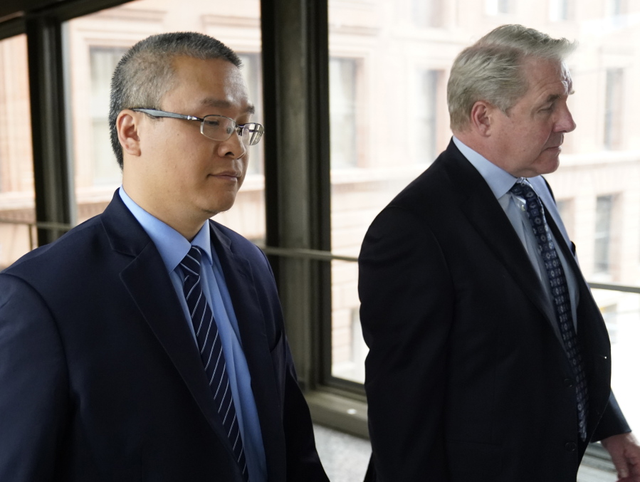 FILE - Former Minneapolis police officer Tou Thao, left, and his attorney Robert Paule arrive for sentencing for violating George Floyd's civil rights outside the Federal Courthouse Wednesday, July 27, 2022, in St. Paul, Minn. A judge has scheduled a hearing for Monday, Aug. 15, 2022, on the status of plea negotiations in the case of the two remaining officers awaiting trial on state charges in the murder of George Floyd. Thao and J. Alexander Kueng face a late October trial.