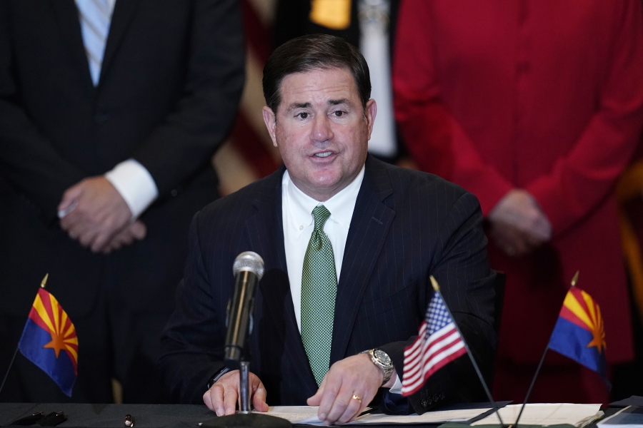 FILE - Arizona Republican Gov. Doug Ducey speaks during a bill signing in Phoenix, Arizona, April 15, 2021,. Ducey is to arrive in Taiwan on Tuesday for a visit focused on semiconductors, the critical chips used in everyday electronics that the island manufactures. (AP Photo/Ross D.