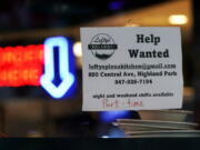 Hiring sign is displayed at a restaurant in Highland Park, Ill., Thursday, July 14, 2022.   The number of Americans applying for unemployment benefits last week rose to its highest level in more than eight months, a sign the labor market may be showing some weakness. Applications for jobless aid for the week ending July 16 rose by 7,000 to 251,000, up from the previous week's 244,000, the Labor Department reported Thursday, July 21.  (AP Photo/Nam Y.