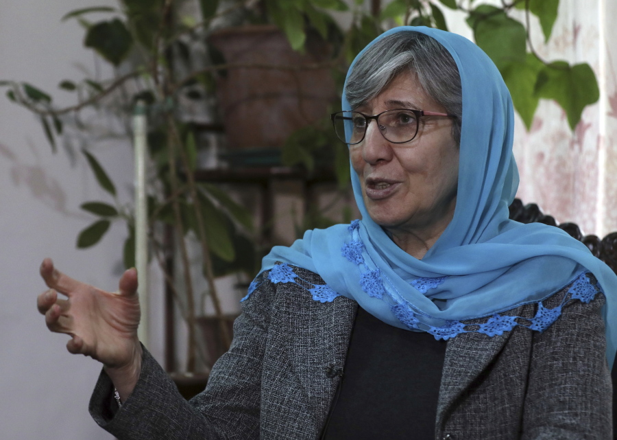 FILE - Sima Samar, a prominent activist and physician, who has been fighting for women's rights in Afghanistan for the past 40 years, gives an interview to The Associated Press, at her house in Kabul, Afghanistan, on March 6, 2021. A year after the Taliban takeover of Afghanistan, prominent Afghan rights activist Sima Samar is still heartbroken over what happened to her country.