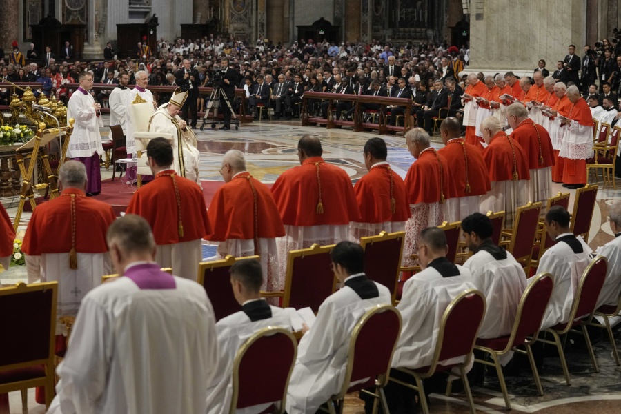Pope Francis prays in front of new Cardinals during consistory inside St. Peter's Basilica, at the Vatican, Saturday, Aug. 27, 2022. Pope Francis has chosen 20 men to become the Catholic Church's newest cardinals.