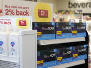 FILE - Boxes of BinaxNow home COVID-19 tests made by Abbott displayed for sale next to liquid hand soap at a CVS store in Lakewood, Wash., Monday, Nov. 15, 2021. People screening themselves at home for COVID-19 may need to use three rapid tests to accurately detect the virus, according to new U.S. recommendations released Thursday, Aug. 11, 2022, that call for a longer testing period. (AP Photo/Ted S.