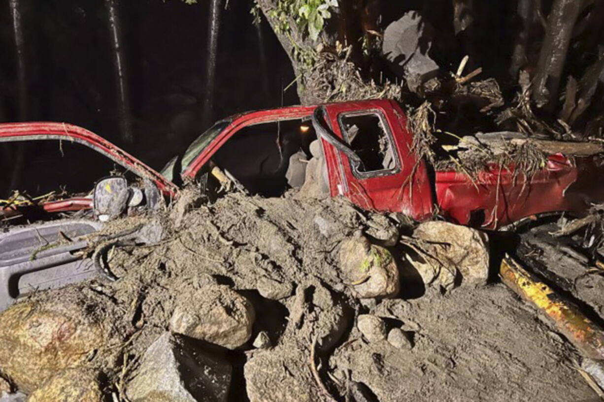 In this photo released by the Siskiyou County Sheriff's Office is the washed away pick up truck of a private contractor who was aiding the firefighting efforts near Klamath River, Calif., Tuesday, Aug. 2, 2022. Amid storms Tuesday the contractor was hurt when a bridge gave out and washed his pickup truck away, said Courtney Kreider, a spokesperson with the Siskiyou County Sheriff's Office. The McKinney Fire was still out of control on Wednesday despite some progress by firefighters who took advantage of thunderstorms that dumped rain and temporarily lowered heat in the parched region.