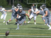 An off-target snap gets behind Union's offense during the first quarter of Saturday's game against Eastlake.
