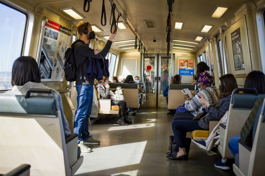 People ride BART from the West Oakland BART Station in Oakland, California, on Friday, March 11, 2022.