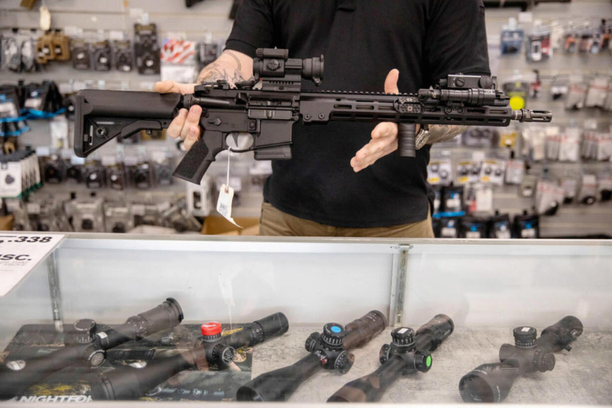 A Geissele AR-15 for sale at Wade's Eastside Guns in Bellevue on Monday, Aug. 22, 2022. Nearly four years after the passage of a bill requiring annual background checks for current owners of pistols and semi-automatic rifles, state officials have yet to implement the checks and have no concrete plans to do so.