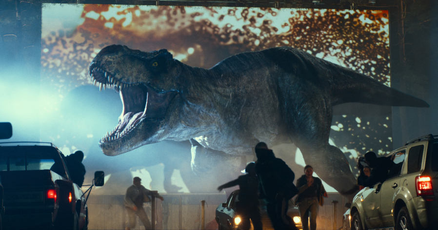 A Tyrannosaurus rex crashes a drive-in movie experience in the new film "Jurassic World Dominion." (Universal Pictures/Amblin Entertainment/TNS) (Disney/Pixar)
