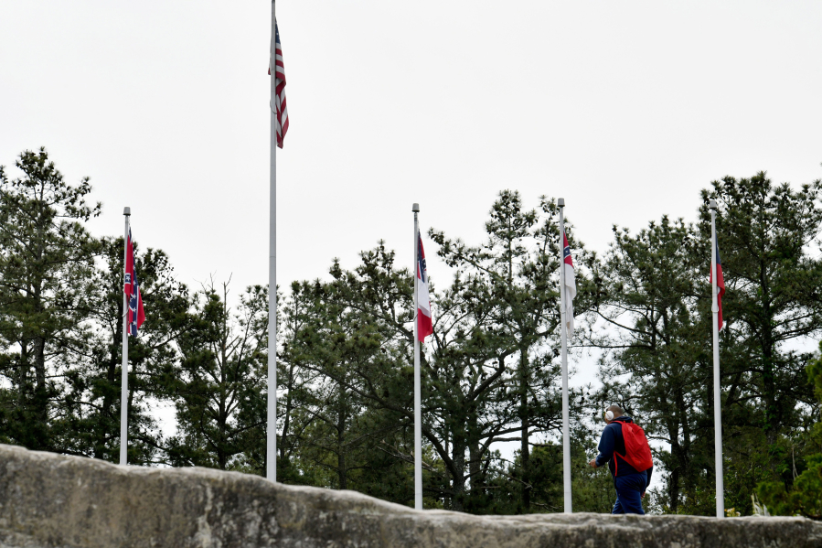 The four Confederate flags fly at the base of Stone Mountain's popular walk-up trail on Tuesday, April 20, 2021, in Georgia.
