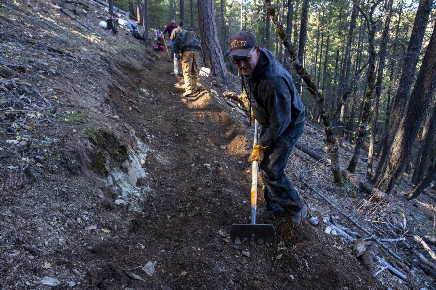Trail boss Henry O'Donnell helps level a new section of the Lost Sierra Route, a 600-mile complex of trails which will link mountain communities together through recreation and economic opportunities, on Feb. 21, 2022, in Quincy, California.