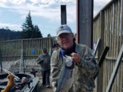 Outdoor reporter Terry Otto with a typical fall Chinook taken while fishing the mouth of the White Salmon River with guide Bill Monroe Jr.
