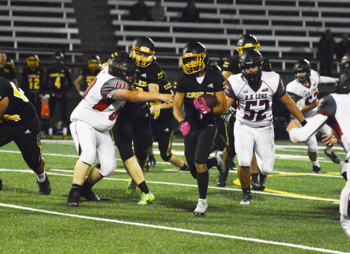 Hudson's Bay running back Rafael Bauman gains yardage in a Class 2A Greater St. Helens League game against R.A. Long on Friday, Sept. 16, 2022 at Kiggins Bowl.