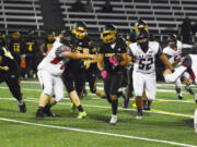 Hudson's Bay running back Rafael Bauman gains yardage in a Class 2A Greater St. Helens League game against R.A. Long on Friday, Sept. 16, 2022 at Kiggins Bowl.