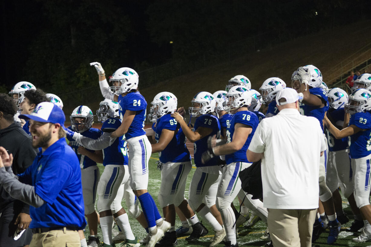 Mountain View players celebrate as the horn sounds after their 62-35 win over Union at McKenzie Stadium on Friday, Sept. 16, 2022.