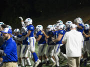 Mountain View players celebrate as the horn sounds after their 62-35 win over Union at McKenzie Stadium on Friday, Sept. 16, 2022.