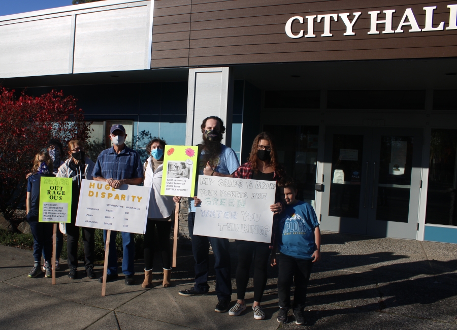 Washougal residents gather in front of City Hall on Oct. 27, 2020, to protest the cost of their water bills. The residents asked city leaders to explain the reasons behind the increased bills, which they say were unexpected and excessive.