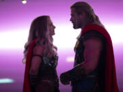 Natalie Portman, left, and Chris Hemsworth in Marvel Studios' "Thor: Love and Thunder." (Jasin Boland/Marvel Studios/TNS)