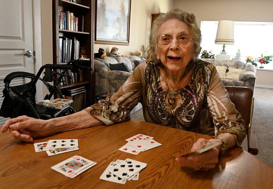 105-year-old Virginia Batzer seperates a deck of cards at her home in Central Point, Ore.