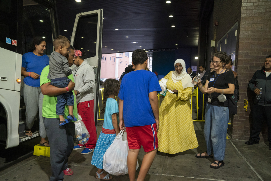 Migrants arrive on a bus at the Port Authority from Texas Thursday, Sept. 22, 2022, in Manhattan.