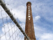 Deconstruction of the old brick Providence Academy smokestack, a landmark of Vancouver, is set to begin Tuesday.