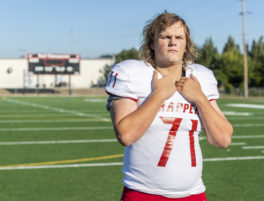 Fort Vancouver senior lineman Kenan Weinmaster stands for a portrait Tuesday, Sept. 6, 2022, at Fort Vancouver High School. Weinmaster is wearing No. 71 -- the same jersey number ex-NFL lineman and Fort grad Travis Claridge wore during his tenure at Fort.