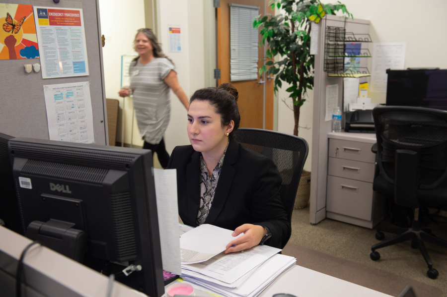 Clark College student Dinara Dursun works at the school's financial aid office. Dursun, a sophomore at Clark, said she's been finding it increasingly difficult to get financial assistance this year.
