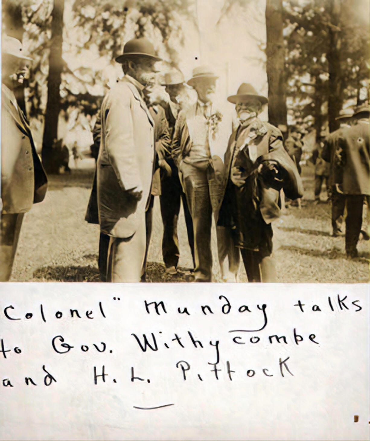 James A. Munday, a Civil War Confederate cavalryman and prisoner of war, was a short man who had a big effect on Clark County. He championed better roads, the Interstate Bridge, and the construction of a port along the Columbia River. In this photo, "Colonel" Munday, right, speaks with Oregon Gov. James Withycombe, left, and Henry Pittock, center, Oregonian publisher, at the Dalles-Celilo Canal Opening Celebration in May 1915.