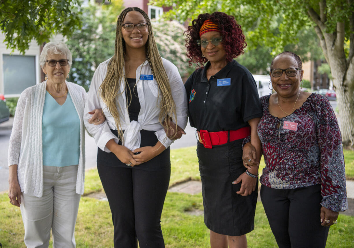 Odyssey World International Education Services board member Rheta Rubenstein, from left, administrative assistant Miracle Joslin, founder and executive director Karen Morrison, and board member Pandora Pierce stand for a portrait outside RichlandHub Coffee Shop.