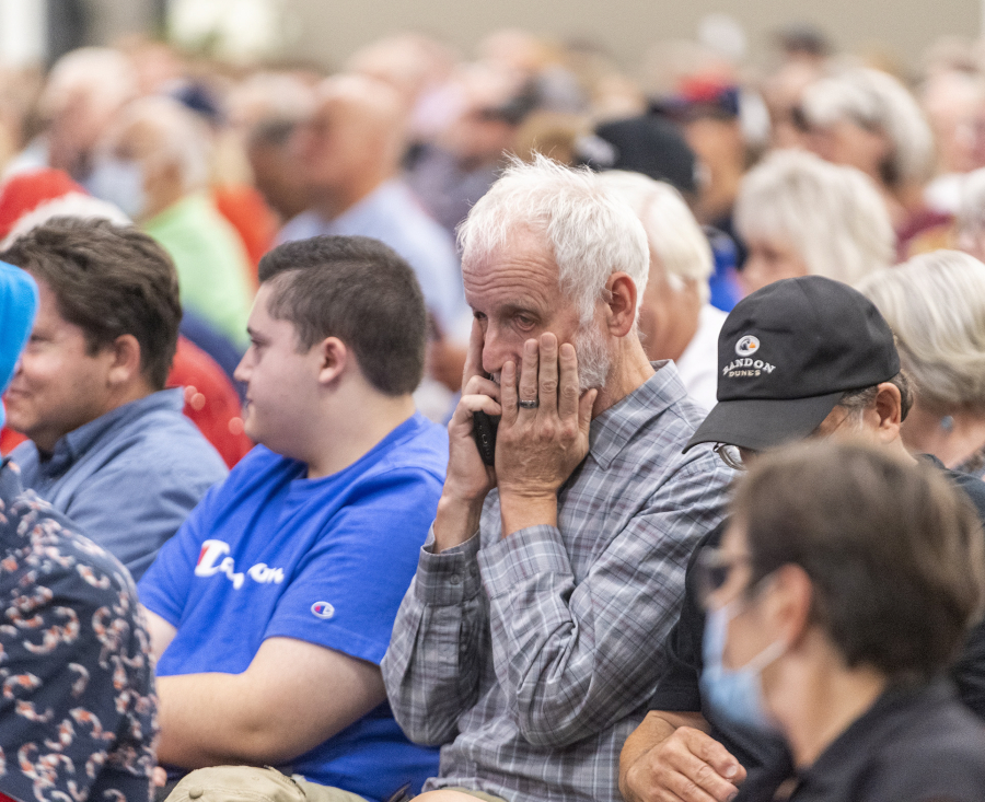 A crowd member reacts to an answer Tuesday during a debate between 3rd Congressional district candidates Joe Kent and Marie Gluesenkamp Perez at RV Inn Style Resorts Convention Center.