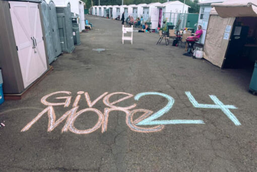 A resident of The Outpost, Vancouver's first Safe Stay Community at 11400 N.E. 51st Circle that Outsiders Inn operates, drew some Give More 24! chalk art during Outsiders Inn's Give More 24! fundraising event.