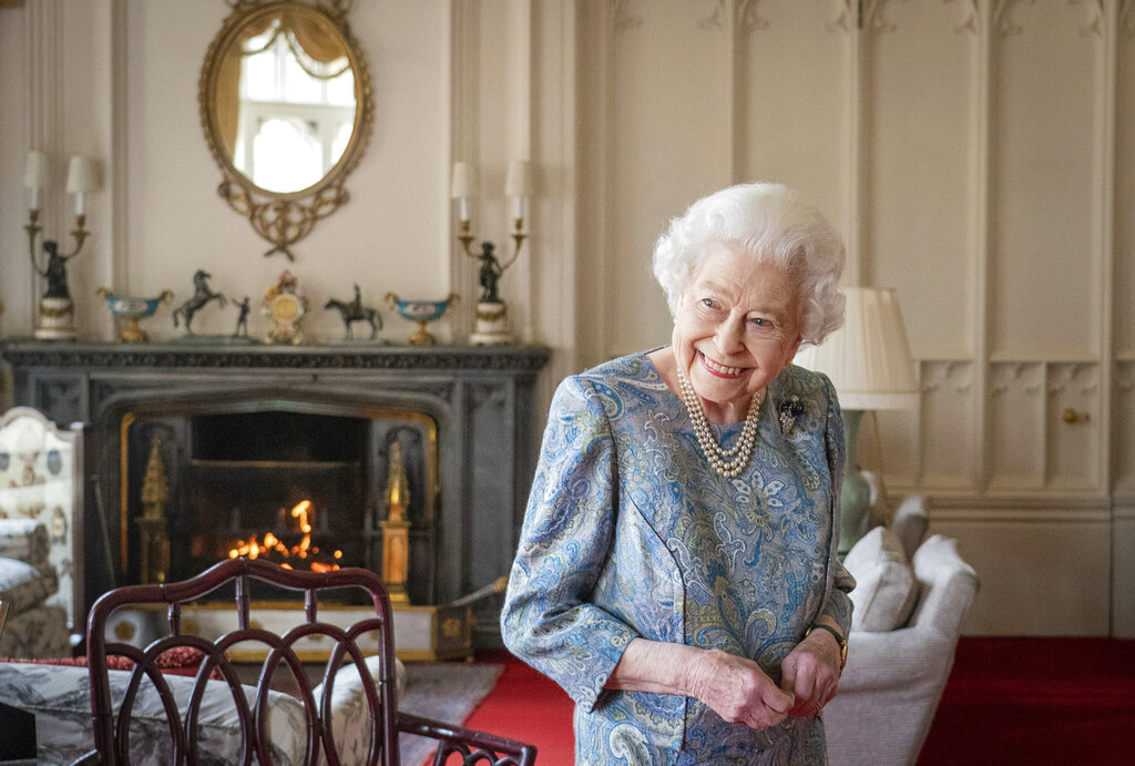 FILE - Britain's Queen Elizabeth II smiles while receiving the President of Switzerland Ignazio Cassis and his wife Paola Cassis during an audience at Windsor Castle in Windsor, England, Thursday, April 28, 2022. Queen Elizabeth II, Britain’s longest-reigning monarch and a rock of stability across much of a turbulent century, has died. She was 96. Buckingham Palace made the announcement in a statement on Thursday Sept.