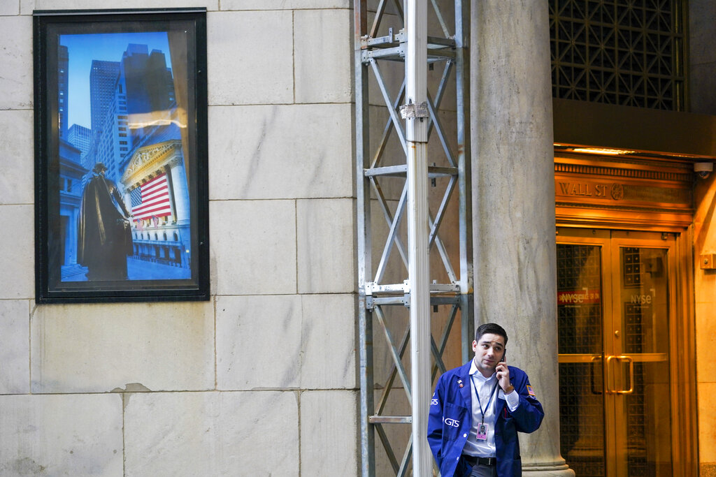 A broker talks on his cell phone outside the New York Stock Exchange building, Tuesday, Sept. 27, 2022, in the Financial District of New York.