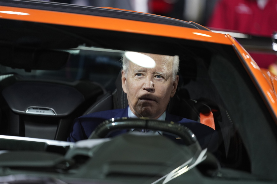 President Joe Biden sits in a Corvette during a tour of the Detroit Auto Show, Wednesday, Sept. 14, 2022, in Detroit.