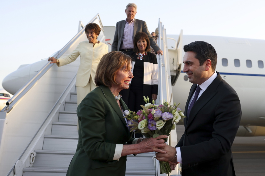 Head of Armenian National Assembly Alen Simonyan, right, welcomes U.S. House of Representatives Nancy Pelosi upon her arrival at the International Airport outside of Yerevan, Armenia, Saturday, Sept. 17, 2022.