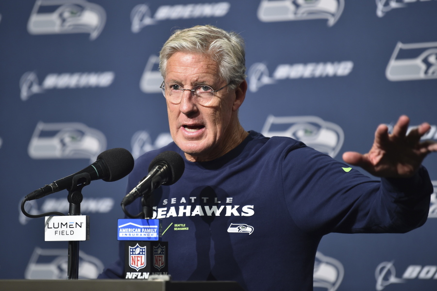 Seattle Seahawks head coach Pete Carroll talks to reporters after a preseason NFL football game against the Chicago Bears, Thursday, Aug. 18, 2022, in Seattle.