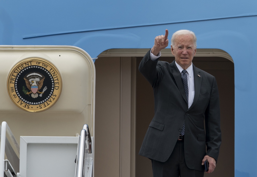 President Joe Biden gestures as he boards Air Force One Monday, Sept. 12, 2022, at Andrews Air Force Base, Md.