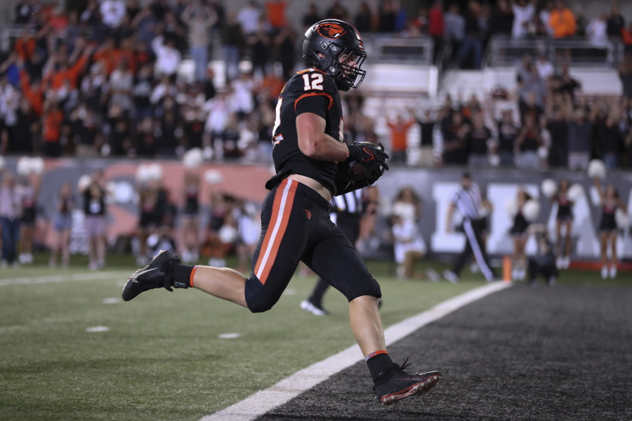 Oregon State Beavers linebacker Jack Colletto (12) scores a touchdown after rushing for 41 yards during the second half of an NCAA college football game against Boise State Saturday, Sept. 3, 2022, in Corvallis, Ore. Oregon State won 34-17.