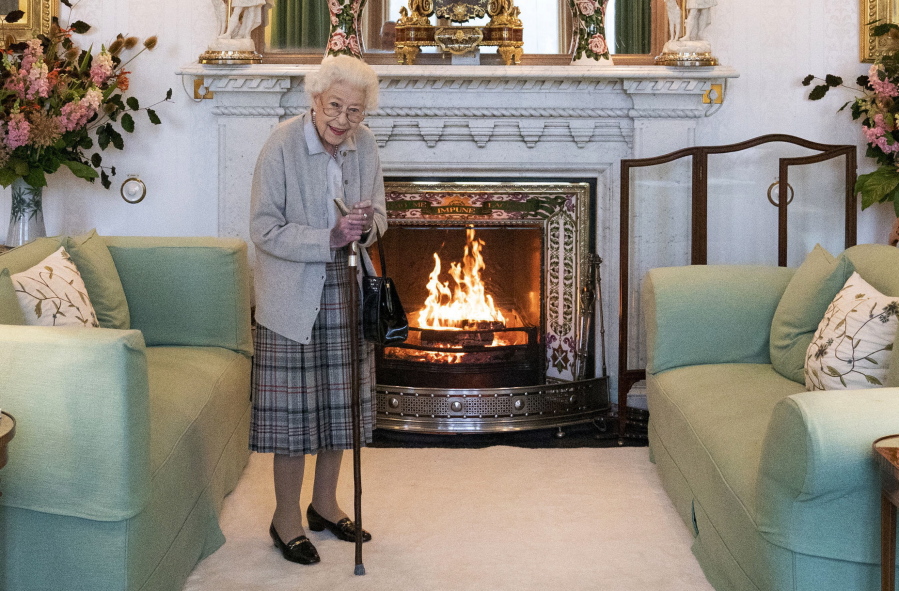 FILE - Britain's Queen Elizabeth II waits in the Drawing Room before receiving Liz Truss for an audience at Balmoral, in Scotland, Tuesday, Sept. 6, 2022, where Truss was invited to become Prime Minister and form a new government.