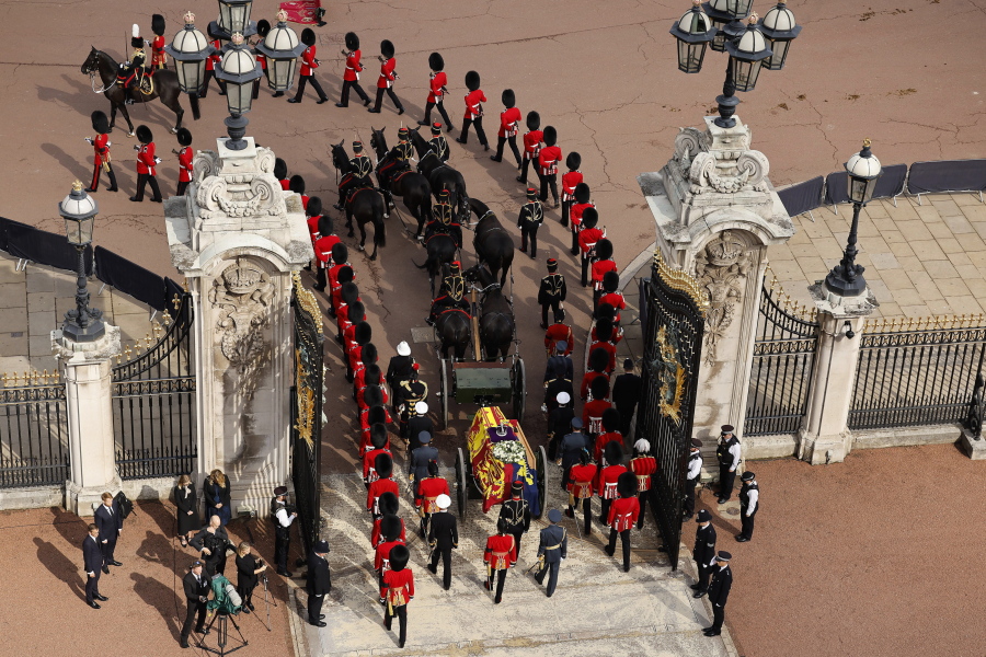 The coffin of Queen Elizabeth II makes its way from Buckingham Palace to Westminster Hall, London, Wednesday Sept. 14, 2022. The Queen will lie in state in Westminster Hall for four full days before her funeral on Monday Sept. 19.