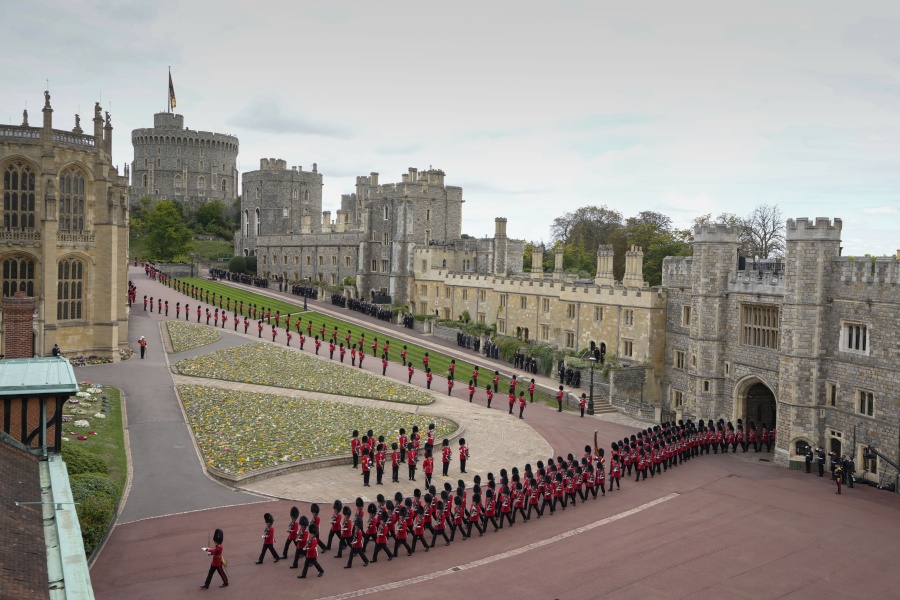 Royal Grenadier guards march onto Windsor Castle grounds in anticipation of the arrival of the coffin of Queen Elizabeth II Monday, Sept. 19, 2022. The Queen, who died aged 96 on Sept. 8, will be buried at Windsor alongside her late husband, Prince Philip, who died last year.