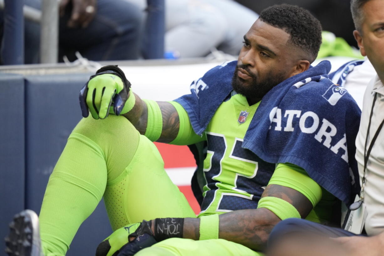 Seattle Seahawks safety Jamal Adams is taken off the field on a cart after an injury during the first half of an NFL football game against the Denver Broncos, Monday, Sept. 12, 2022, in Seattle.