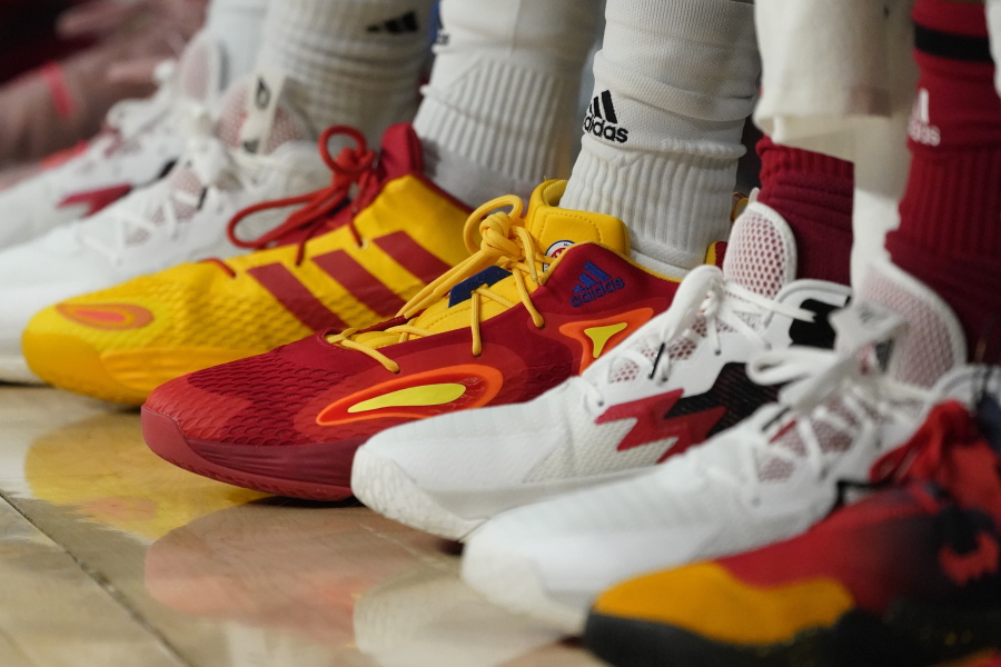 FILE - Basketball sneakers are seen at a game, Tuesday, March 29, 2022, in Chicago. Buy now, pay later loans allow users to pay for items such as new sneakers, electronics or luxury goods in installments.