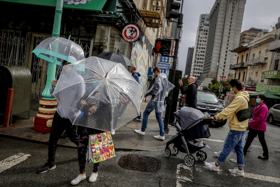 Rain drenches streets in Chinatown in San Francisco, on Sunday, Sept. 18, 2022. The rainstorm is a dramatic shift of events for many residents after a record heat wave and grueling wildfire season. (Bront?