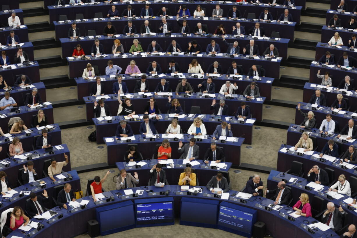 European lawmakers vote on climate change issues at the European Parliament in Strasbourg, eastern France, Tuesday, Sept. 13, 2022. European Union lawmakers have backed a proposal for a law that would ban the sale in the 27-nation bloc of agriculture products linked to the destruction of forests.