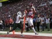 Washington State wide receiver De'Zhaun Stribling, right, catches a pass for a touchdown while defended by Colorado State defensive back Brandon Guzman during the first half of an NCAA college football game, Saturday, Sept. 17, 2022, in Pullman, Wash.