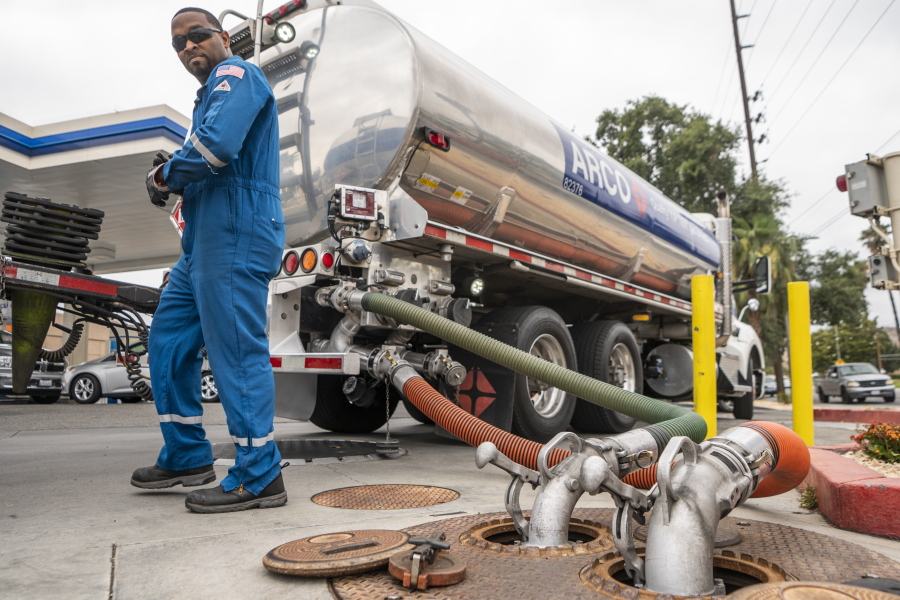 FILE - A driver delivers 8,500 gallons of gasoline at an ARCO gas station in Riverside, Calif., Saturday, May 28, 2022.