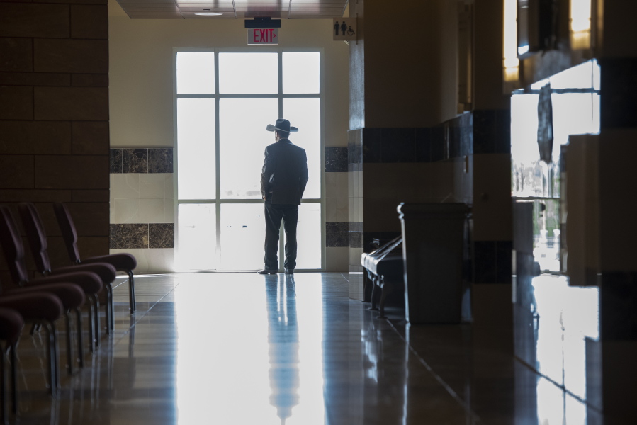 Otero County Commissioner Couy Griffin waits to leave First District Court on Tuesday, Aug. 16, 2022, in Santa Fe, N.M., after a civil trial to remove him from office for his participation in last year's insurrection at the U.S. Capitol.