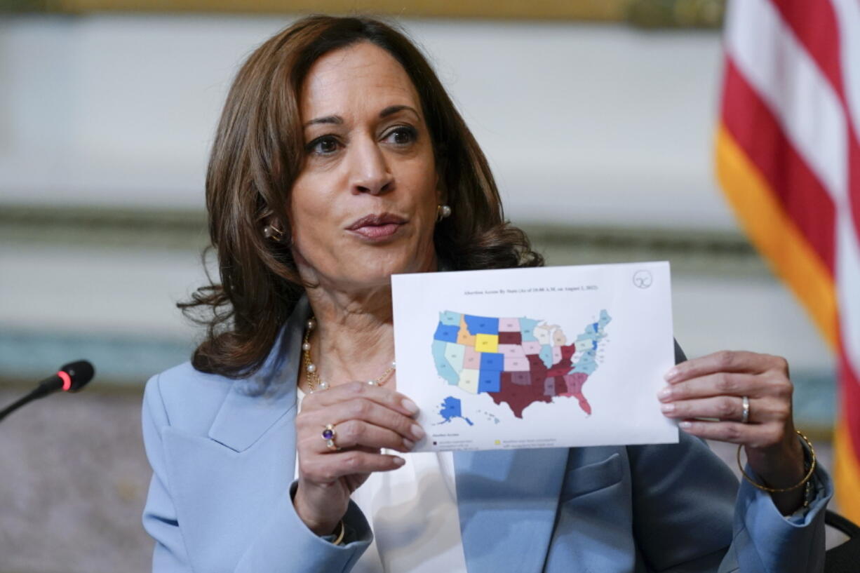 FILE - Vice President Kamala Harris displays a map showing abortion access by state as she speaks during the first meeting of the interagency Task Force on Reproductive Healthcare Access in the Indian Treaty Room in the Eisenhower Executive Office Building on the White House Campus in Washington, Aug. 3, 2022.