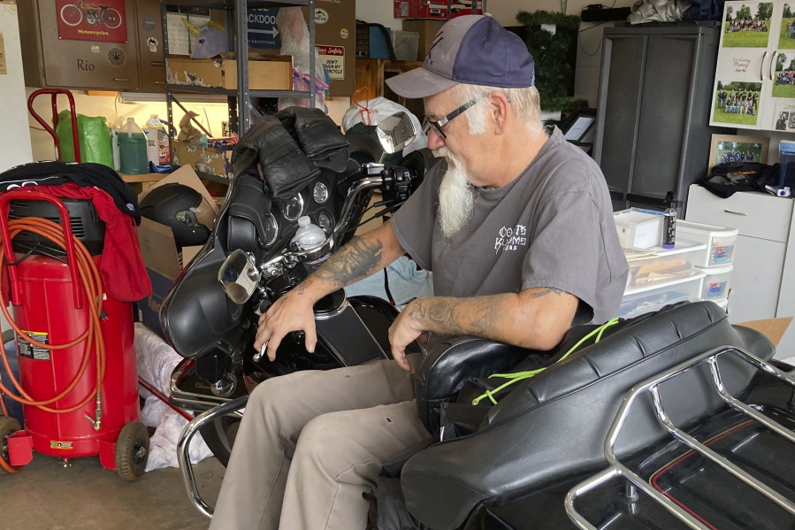 Steve Gray, a 61-year-old moderate Republican "though never a Trump fan," sits on one of his Harley Davidson motorcycles inside his garage in Rio, Wis., on Sept. 12, 2022. Gray, a school maintenance manager, said he is frustrated with the June U.S. Supreme Court decision overturning Roe v. Wade because it gave Trump a policy win despite being out of office. Gray is among voters nationally who have drifted toward supporting Democrats in November.